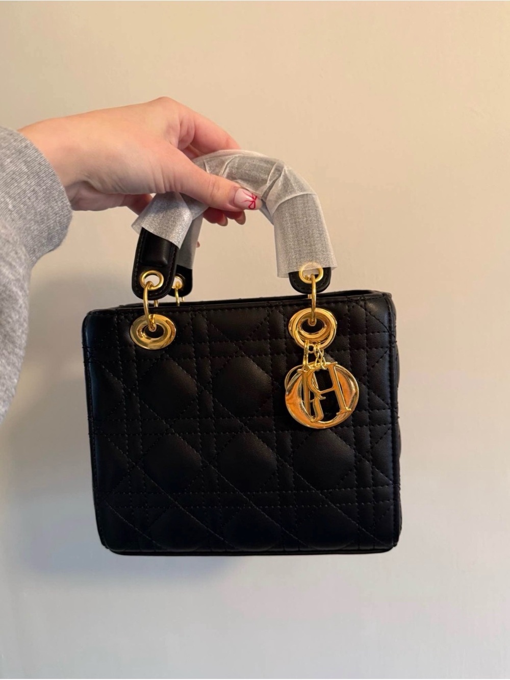 Black Quilted Mini Top-Handle Bag with Gold Charm Accent